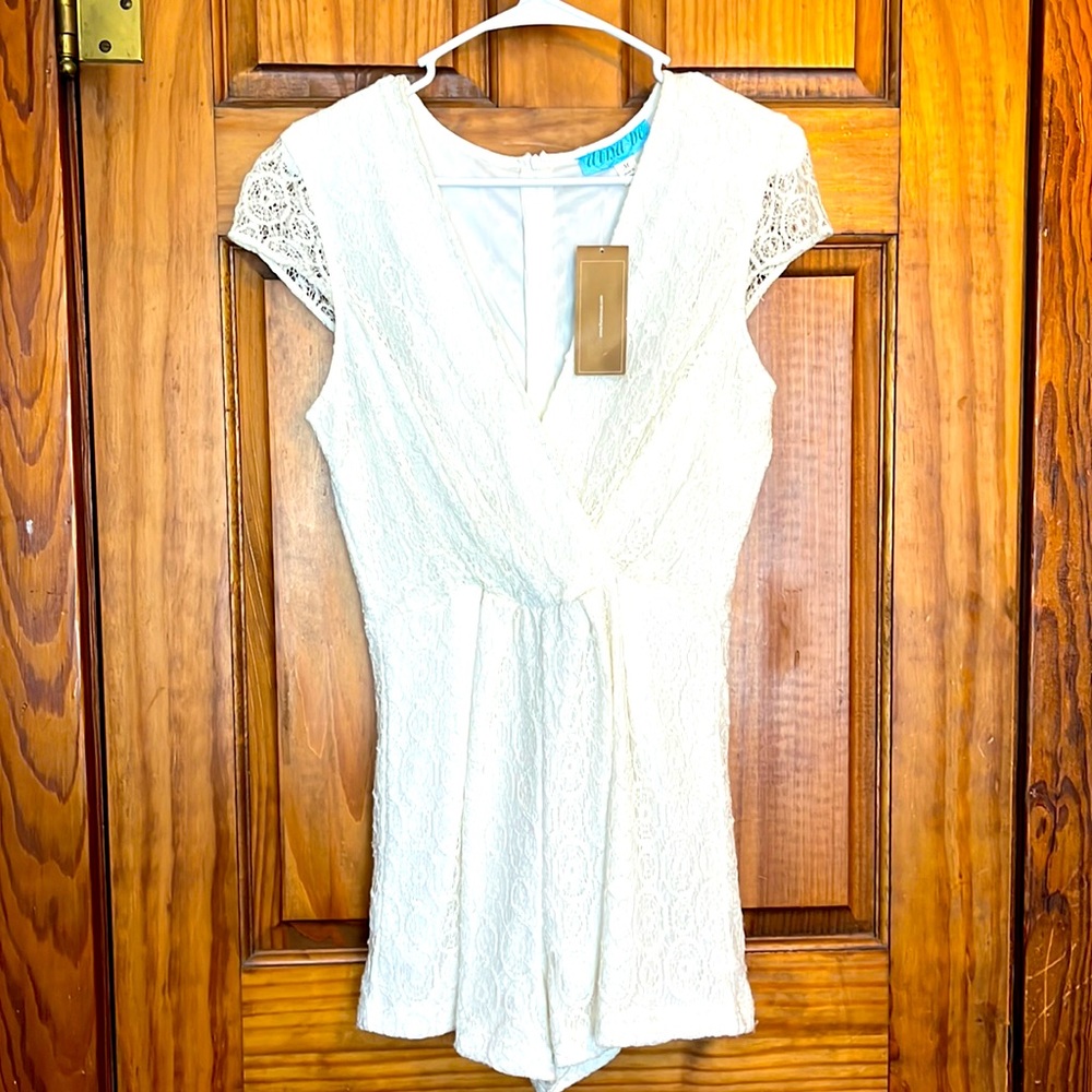Ladies ivory and lace, medium romper by: Francesca’s.